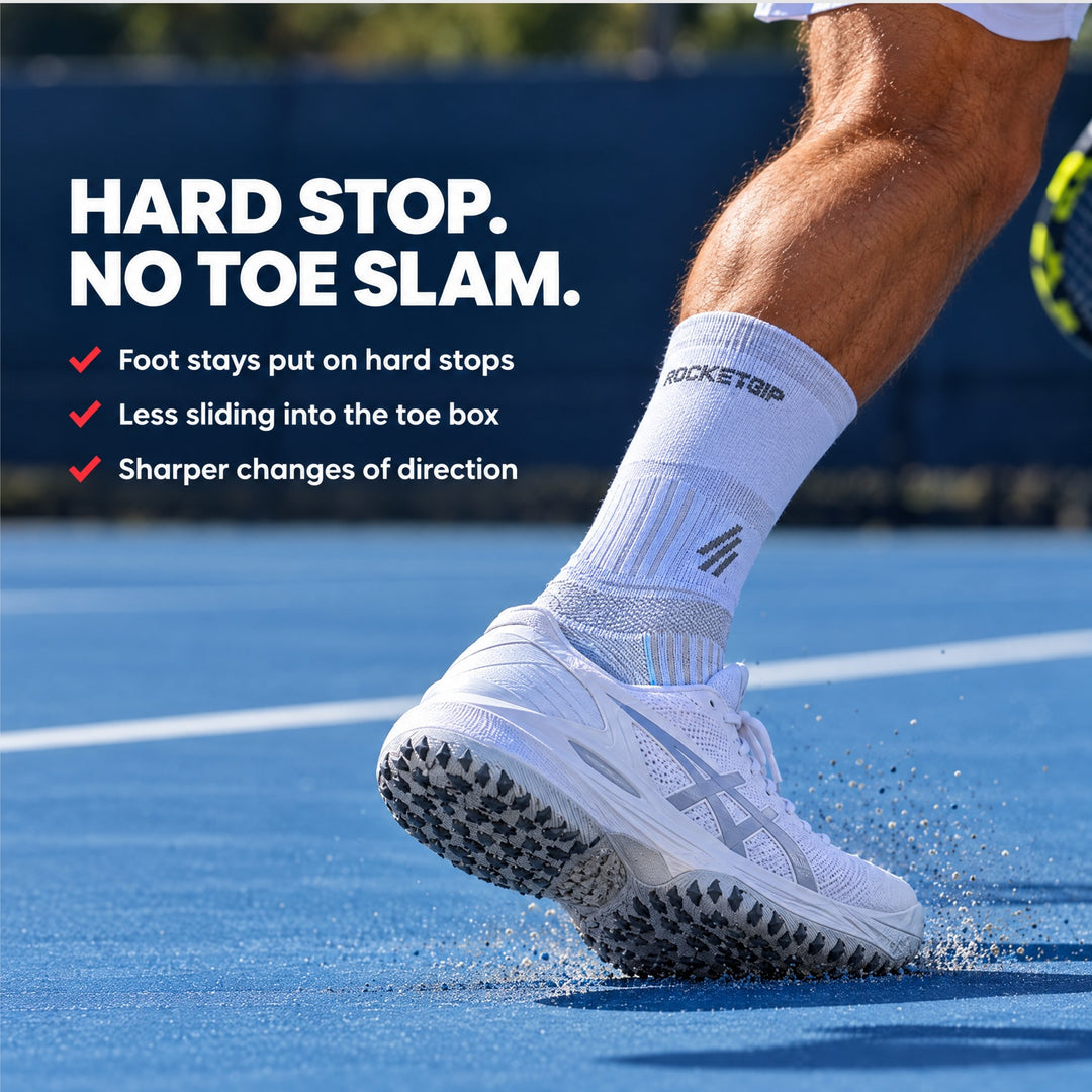 Tennis player wearing RocketGrip grip socks on a hard court